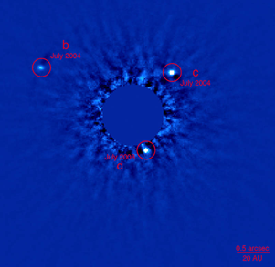 Fig. 1 - Prima immagine della stella HR 8799 dove si possono vedere i primi 3 pianeti scoperti. Press release del 9 novembre 2008 - Crediti Gemini Observatory.
