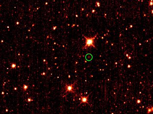 Fig. 3 - L'asteroide 2010 TK7 (cerchiato in verde, in basso a destra) in un'immagine ripresa dalla sonda WISE della NASA.