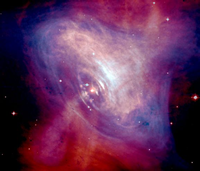 Fig. 1 - Immagine composita (banda ottica in rosso e banda X in blu) della Crab Pulsar che "vive" al centro del resto di supernova della Nebulosa del Granchio ovvero ciò che rimane di una stella esplosa nel 1054. Crediti: J. Hester (ASU) et al., CXC, HST, NASA - APOD del 26 marzo 2005